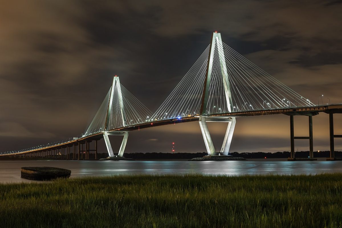 Arthur Ravenel Jr. Bridge (also known as the Cooper River Bridge) at night, looking northwest from Mount Pleasant, South Carolina. [Juliancolton, CC BY-SA 4.0 https://creativecommons.org/licenses/by-sa/4.0, via Wikimedia Commons]