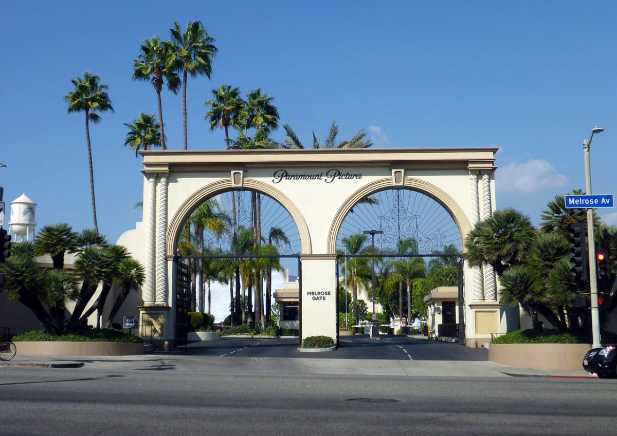 The Melrose Gate entrance to the studio lot of Paramount Pictures in the Hollywood neighborhood of Los Angeles, California. [Coolcaesar, CC BY-SA 4.0 https://creativecommons.org/licenses/by-sa/4.0, via Wikimedia Commons]
