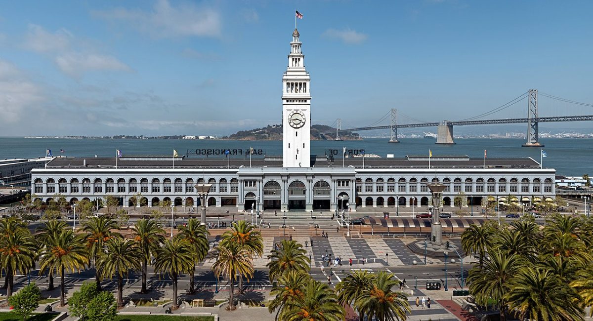 The Ferry Building is a terminal for ferries on the San Francisco Bay and an upscale shopping center located on The Embarcadero in San Francisco, California. The Bay Bridge can be seen in the background. [JaGa, CC BY-SA 4.0 https://creativecommons.org/licenses/by-sa/4.0, via Wikimedia Commons]