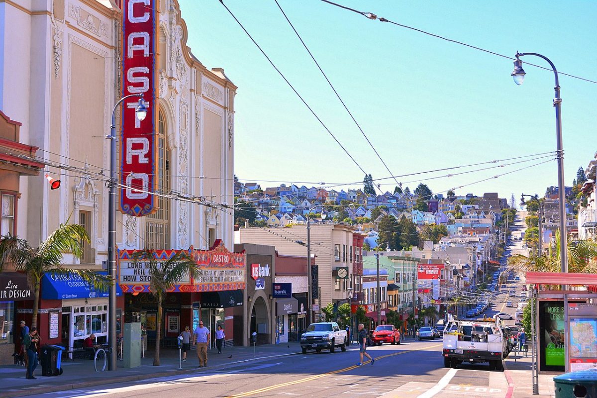 The Castro is the name of the theatre and the district of San Francisco. The Castro Theatre was built in 1922. The Castro district was one of the first gay neighborhoods in the United States [Mike McBey, CC BY 2.0 https://creativecommons.org/licenses/by/2.0, via Wikimedia Commons]